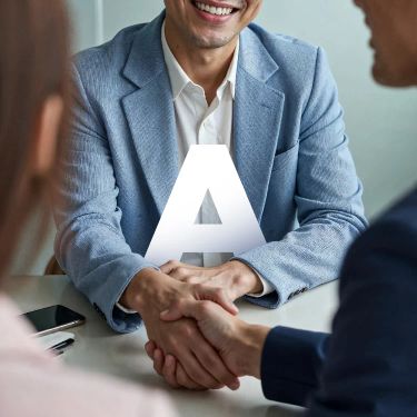Handshake across a desk — temporary unlicensed stock preview, pending a licensed replacement